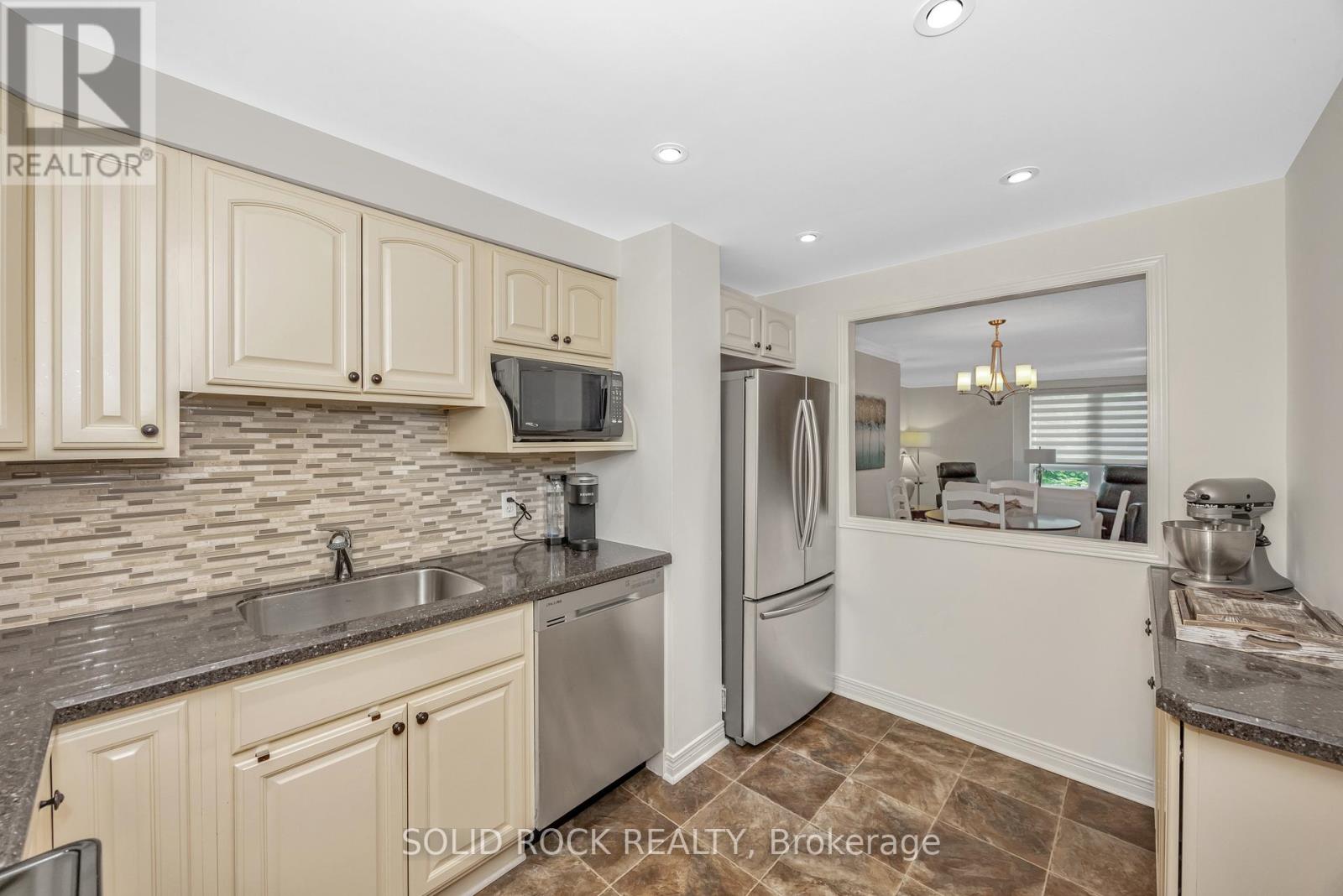 302 - 939 North River Road
