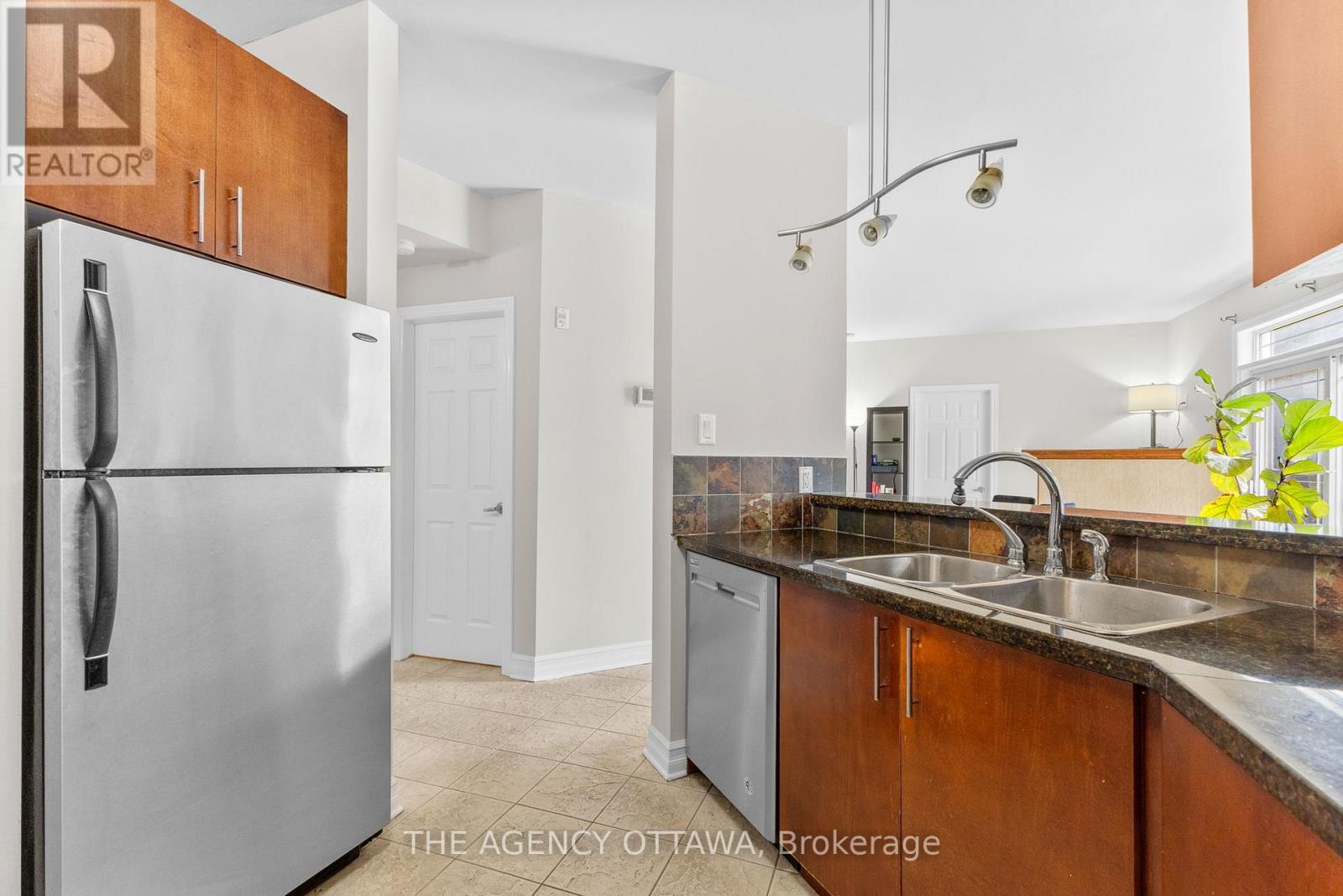 203 - 711 Churchill Avenue N