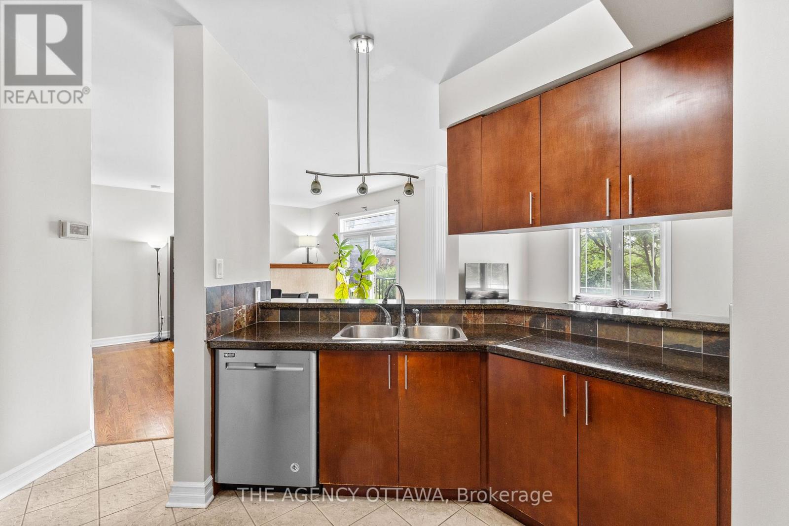 203 - 711 Churchill Avenue N