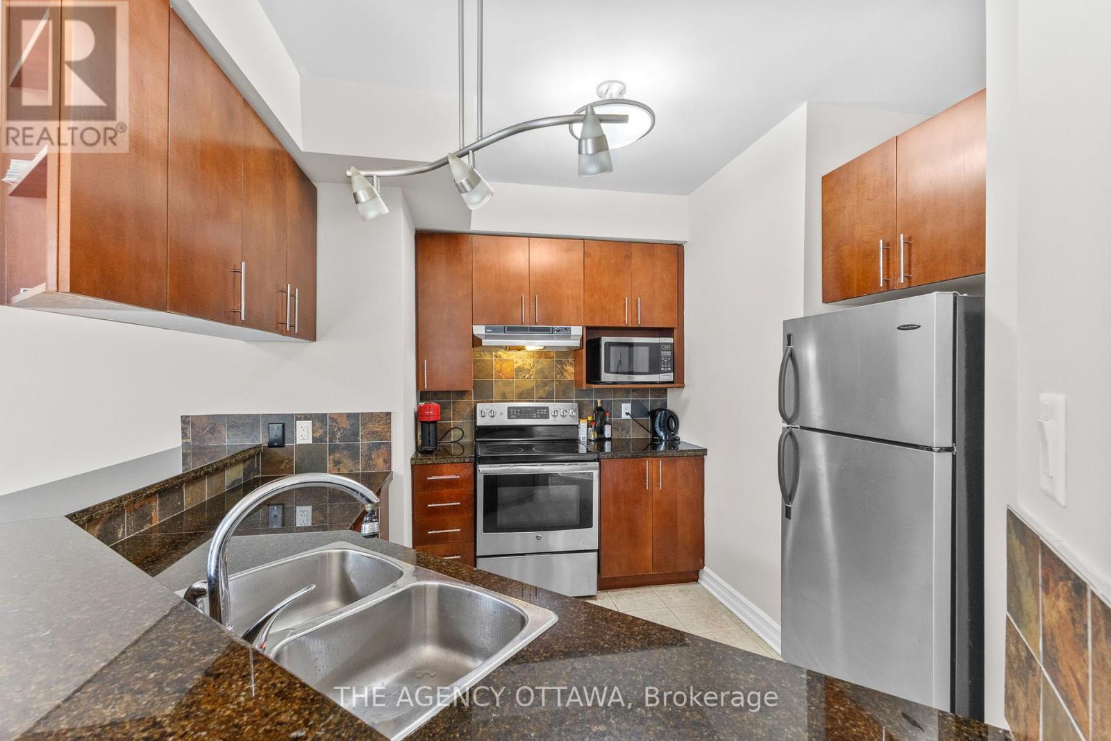 203 - 711 Churchill Avenue N